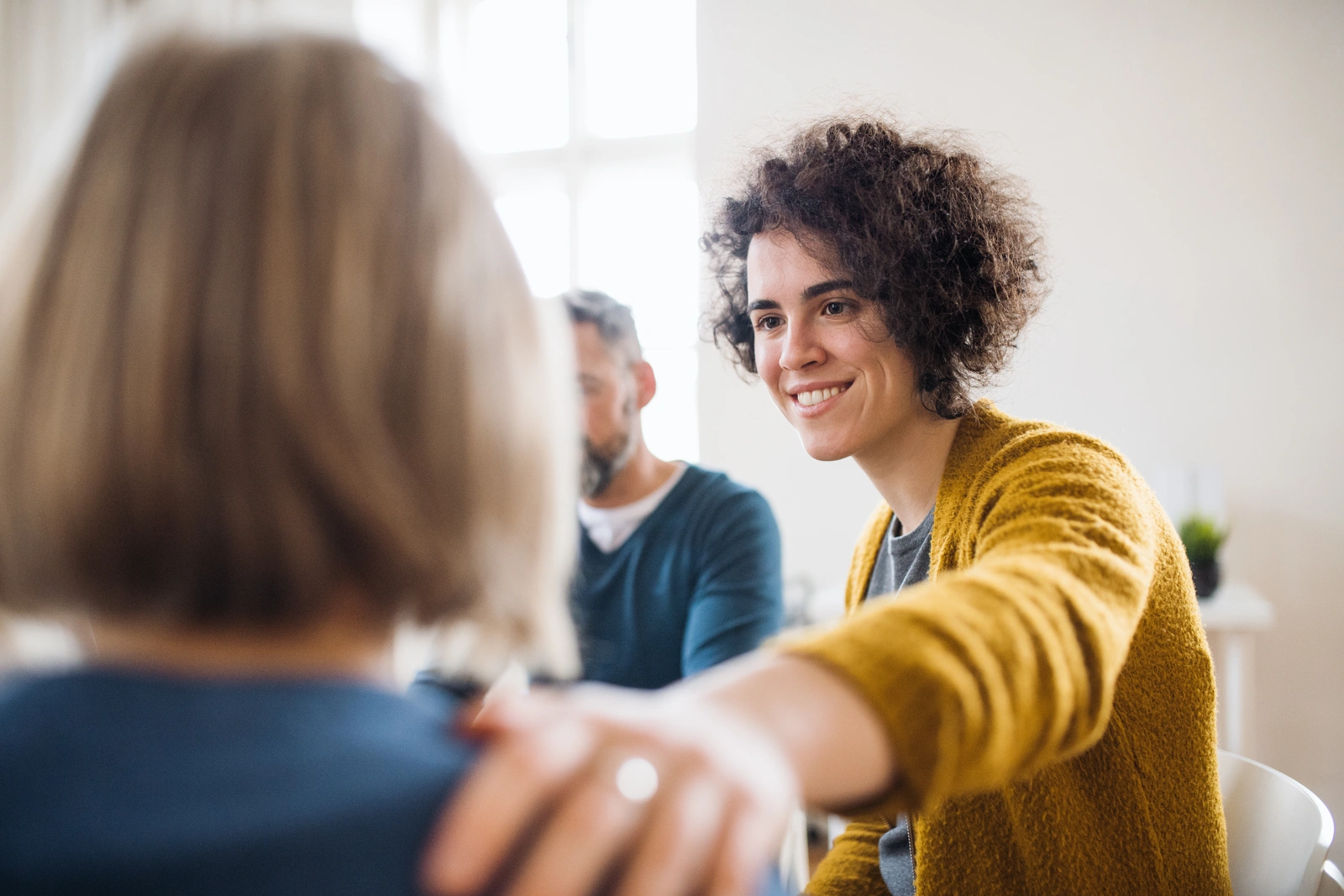 a woman offering support to a fellow attendee