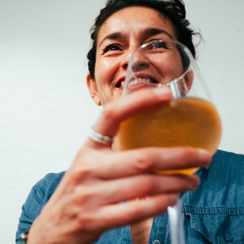 woman holding glass of alcohol - how to help my wife with drinking problem