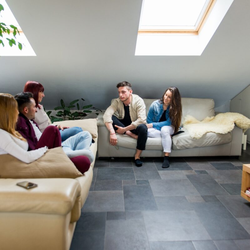 group of people at a sober living home - benefits of sober living homes