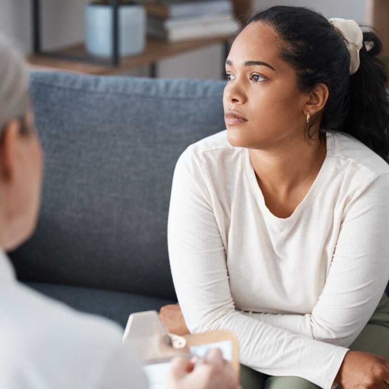 woman speaking with a therapist during a partial hospitalization program