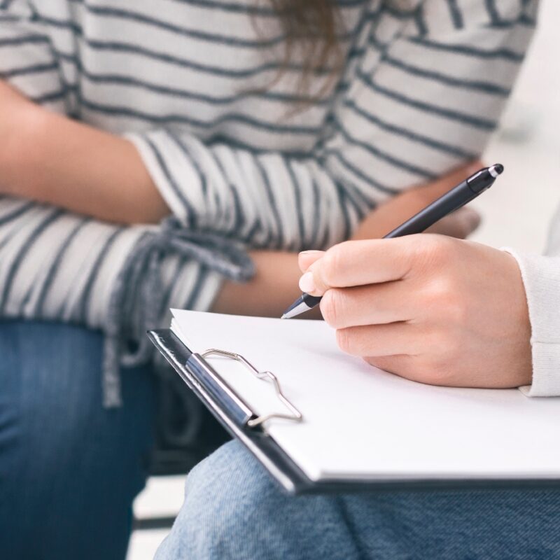 therapist drawing our a relapse prevention plan for client