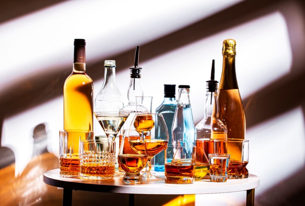 alcohol bottles on a table - alcohol withdrawal timeline