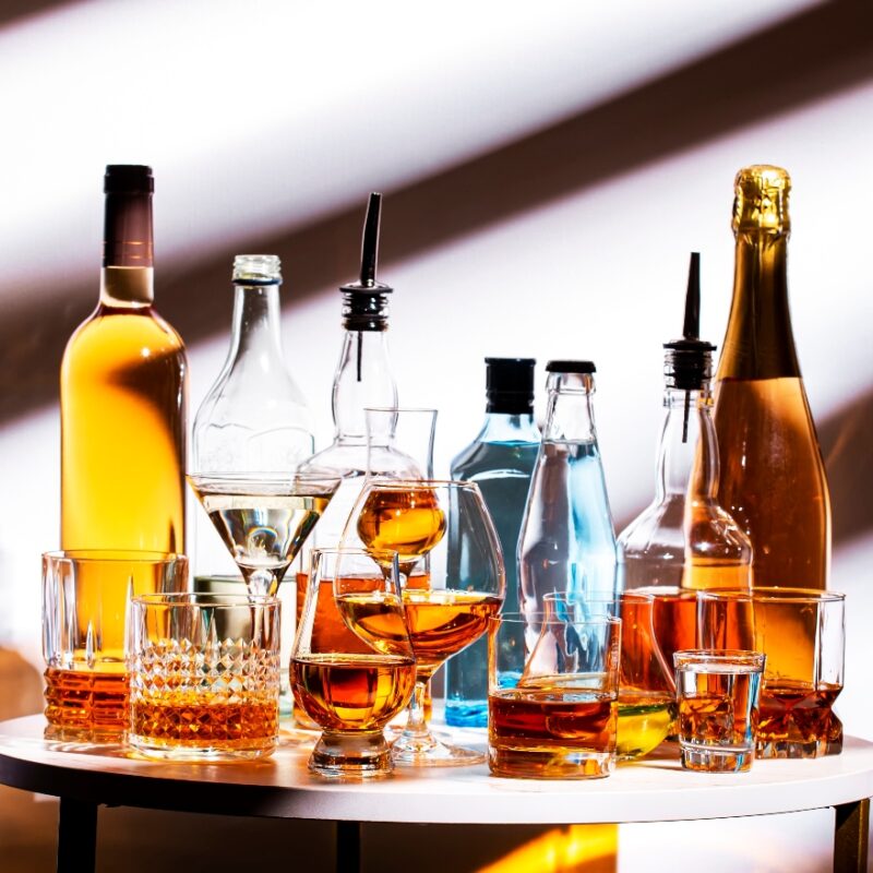 alcohol bottles on a table - alcohol withdrawal timeline