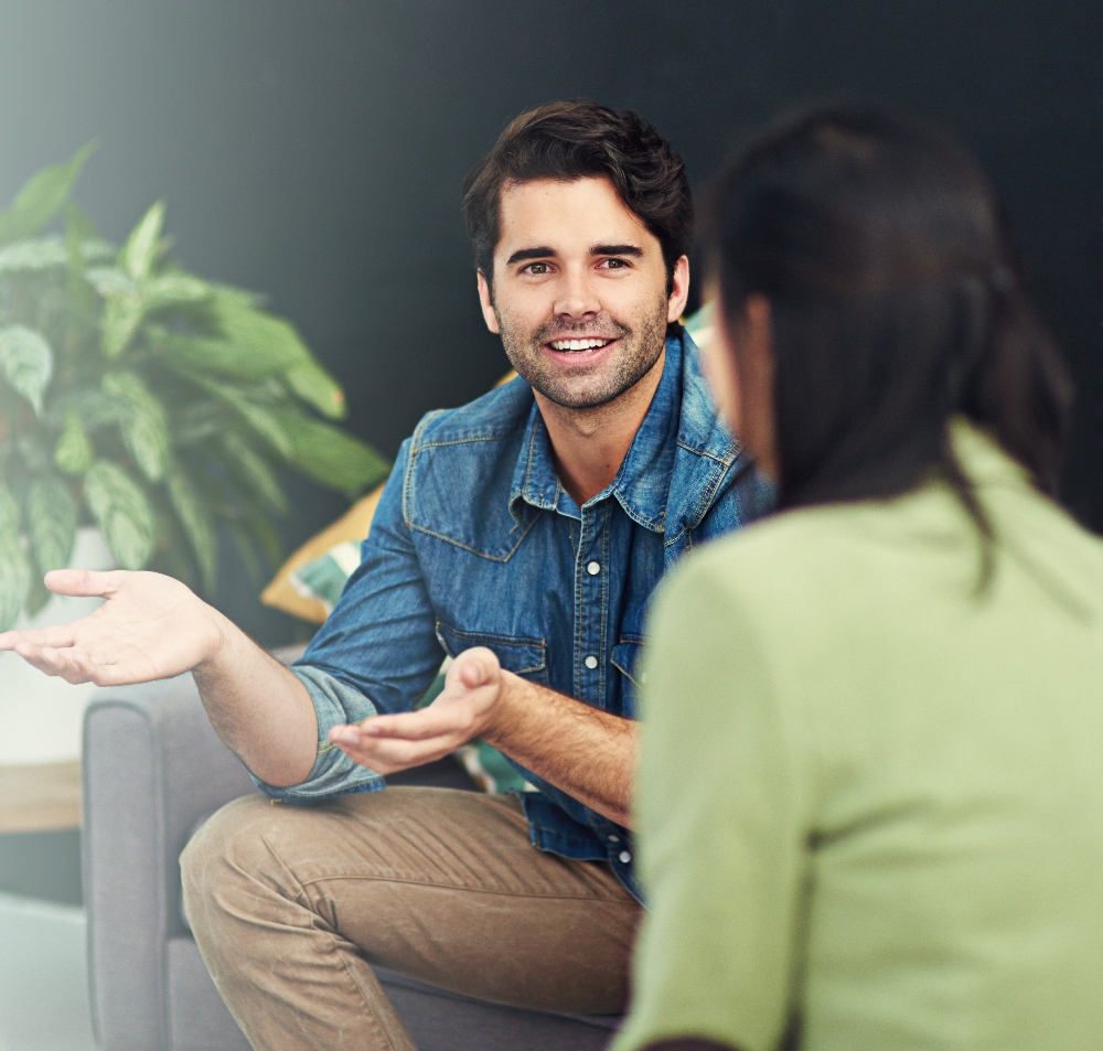 man speaking with therapist