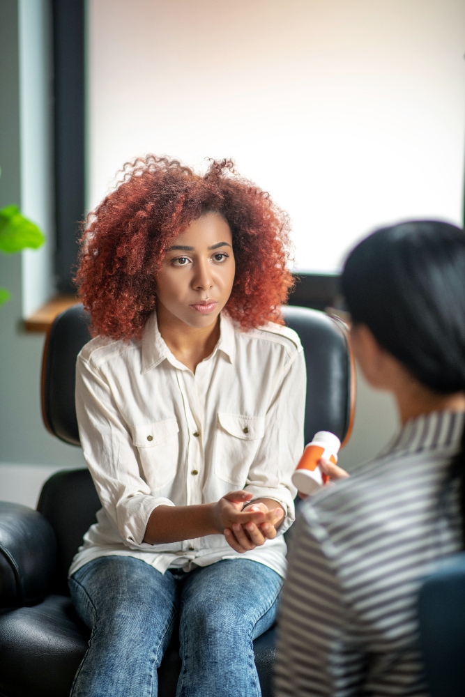 woman speaking to therapist - hugh medical acuity