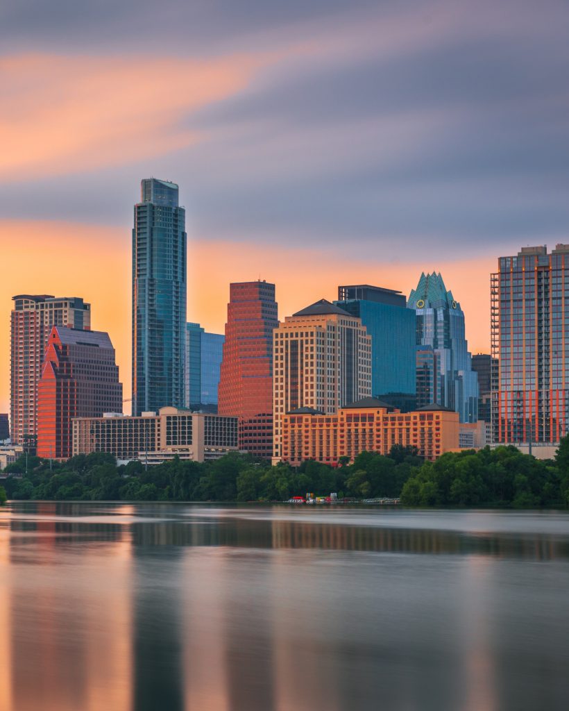 Austin, texas, usa downtown skyline over the colorado river at dawn.
