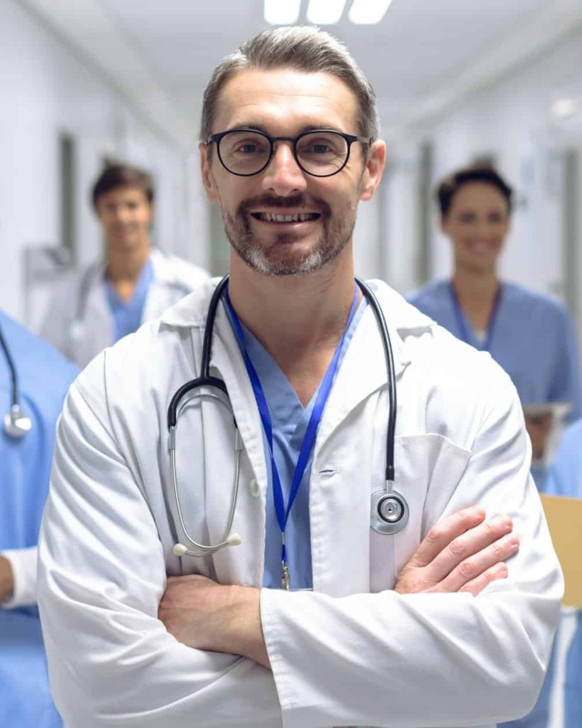 Diverse-medical-team-of-doctors-looking-at-camera-while-holding-clipboard-and-medical-files. Jpg